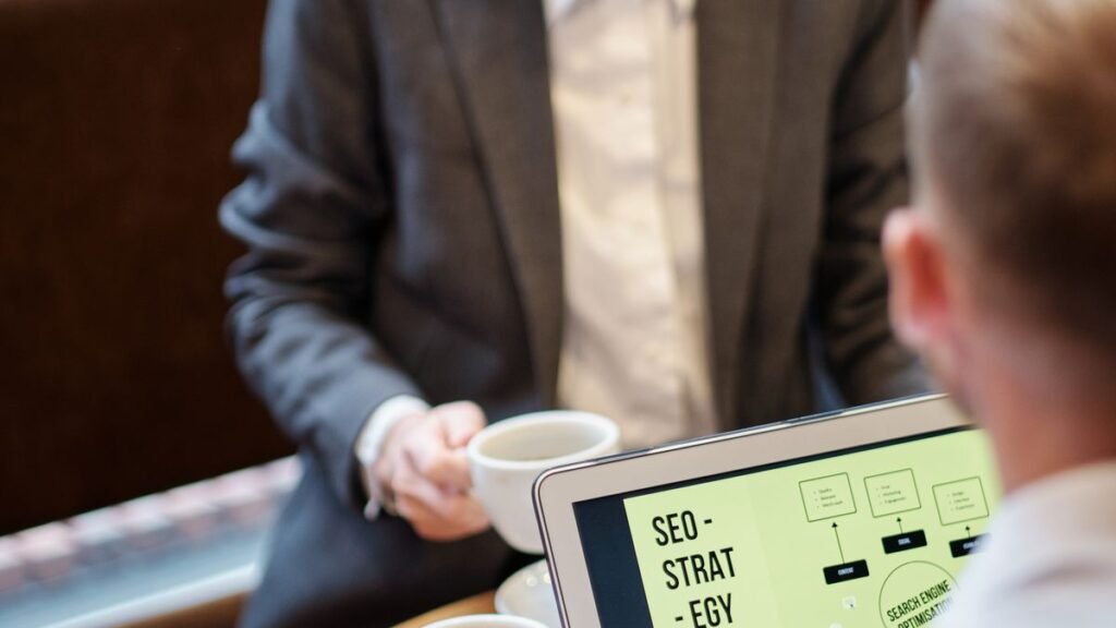 Two specialists reviewing an SEO strategy, the first step of a niche edits service engagement